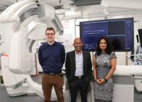 Interventional Radiology Fellow Dr Paul Jenkins, HPB & Transplant Consultant Surgeon Mr Somaiah Aroori and Consultant Interventional Radiologist Dr Nelofer Gafoor in a theatre in front of equipment